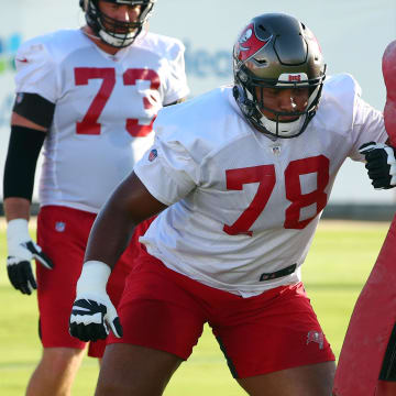 Sep 2, 2020; Tampa, Florida, USA; Tampa Bay Buccaneers offensive tackle Tristan Wirfs (78) and guard John Molchon (75) work out at AdventHealth Training Center. Mandatory Credit: Kim Klement-USA TODAY Sports
