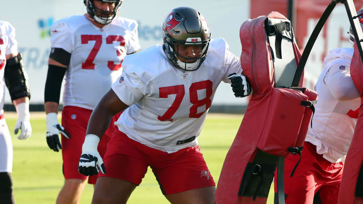 Sep 2, 2020; Tampa, Florida, USA; Tampa Bay Buccaneers offensive tackle Tristan Wirfs (78) and guard John Molchon (75) work out at AdventHealth Training Center. Mandatory Credit: Kim Klement-USA TODAY Sports