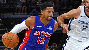 Oct 6, 2025; Memphis, Tennessee, USA; Detroit Pistons forward Tobias Harris (12) drives to the basket as Memphis Grizzlies forward Santi Aldama defends during the first quarter at FedExForum. Mandatory Credit: Petre Thomas-Imagn Images
