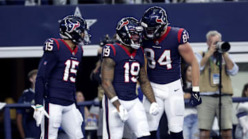 Dec 11, 2022; Arlington, Texas, USA;  Houston Texans wide receiver Amari Rodgers (19)  celebrates with Houston Texans wide receiver Chris Moore (15) and Houston Texans tight end Teagan Quitoriano (84) after catching a touchdown  pass during the first half against the Dallas Cowboys at AT&T Stadium. Mandatory Credit: Kevin Jairaj-Imagn Images