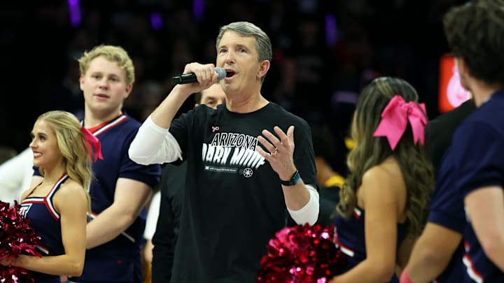 Jan 17, 2024; Tucson, Arizona, USA; Arizona Wildcats new head football coach Brett Brennan (center) gets introduced to the Arizona Wildcats crowd during the first half at McKale Center. Mandatory Credit: Zachary BonDurant-USA TODAY Sports