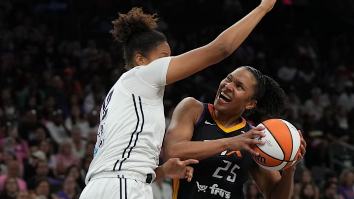 Aug 22, 2025; Phoenix, Arizona, USA; Phoenix Mercury forward Alyssa Thomas (25) drives on Golden State Valkyries center Iliana Rupert (12) in the second half at Footprint Center. Mandatory Credit: Rick Scuteri-Imagn Images Aug 22, 2025; Phoenix, Arizona, USA; Phoenix Mercury forward Alyssa Thomas (25) drives on Golden State Valkyries center Iliana Rupert (12) in the second half at Footprint Center. Mandatory Credit: Rick Scuteri-Imagn Images