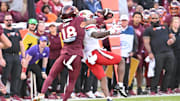 Nov 1, 2025; Blacksburg, Va.; Virginia Tech safety Isaiah Cash (18) bats away the ball.