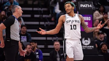 Mar 7, 2025; Sacramento, California, USA; San Antonio Spurs forward Jeremy Sochan (10) argues a call with referee Scott Twardoski (52) during the fourth quarter of the game against the Sacramento Kings at Golden 1 Center. Mandatory Credit: Ed Szczepanski-Imagn Images