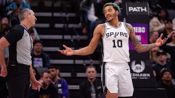 Mar 7, 2025; Sacramento, California, USA; San Antonio Spurs forward Jeremy Sochan (10) argues a call with referee Scott Twardoski (52) during the fourth quarter of the game against the Sacramento Kings at Golden 1 Center. Mandatory Credit: Ed Szczepanski-Imagn Images