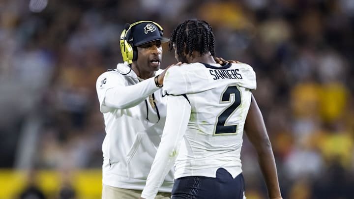 Deion Sanders coaching his son and quarterback Shedeur Sanders during a 2023 game against the Arizona State Sun Devils. 