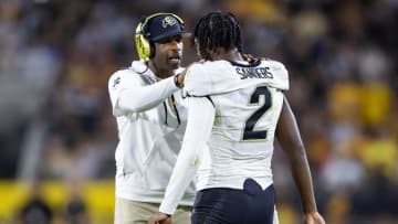 Colorado Buffaloes head coach Deion Sanders with son and quarterback Shedeur Sanders (2)