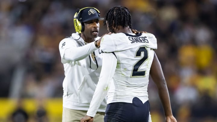 Colorado Buffaloes head coach Deion Sanders with son and quarterback Shedeur Sanders (2)