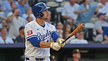 Jul 9, 2025; Kansas City, Missouri, USA;  Kansas City Royals right fielder Jac Caglianone (14) hits a two-run home run in the fourth inning against the Pittsburgh Pirates at Kauffman Stadium. Mandatory Credit: Peter Aiken-Imagn Images
