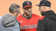 Apr 29, 2025; Cleveland, Ohio, USA; Curtis Danburg (left) of the Cleveland Guardians talks with managers Stephen Vogt (center) and Rocco Baldelli during a weather delay at Progressive Field. Mandatory Credit: David Richard-Imagn Images