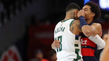 Feb 21, 2025; Washington, District of Columbia, USA; Former teammates Milwaukee Bucks forward Kyle Kuzma (18) and Washington Wizards guard Jordan Poole (13) hug prior to their game at Capital One Arena. Mandatory Credit: Geoff Burke-Imagn Images