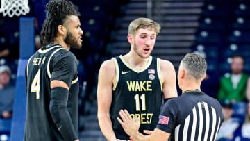 Feb 27, 2024; South Bend, Indiana, USA; An official talks with Wake Forest Demon Deacons forward Andrew Carr (11) in the first half against the Notre Dame Fighting Irish at the Purcell Pavilion. Mandatory Credit: Matt Cashore-USA TODAY Sports