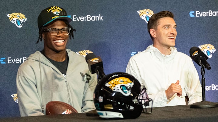 The Jacksonville Jaguars’ first-round pick, Colorado Buffaloes wide receiver and defensive back Travis Hunter, left, has a laugh during a press conference Friday, March 25, 2025 at Miller Electric Center in Jacksonville, Fla. with General Manager James Gladstone, right. [Doug Engle/Florida Times-Union]