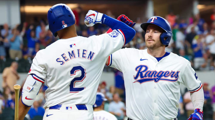 Jul 24, 2024; Arlington, Texas, USA; Texas Rangers right fielder Robbie Grossman (4) celebrates with Texas Rangers second baseman Marcus Semien (2) after hitting a home run during the eighth inning against the Chicago White Sox at Globe Life Field. Mandatory Credit: Kevin Jairaj-USA TODAY Sports