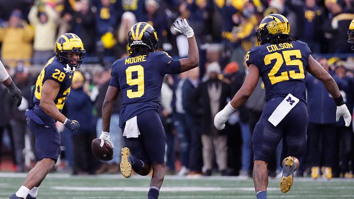 Nov 25, 2023; Ann Arbor, Michigan, USA; Michigan Wolverines defensive back Rod Moore (9) celebrates after he makes an interception in the second half against the Ohio State Buckeyes at Michigan Stadium. Mandatory Credit: Rick Osentoski-USA TODAY Sports