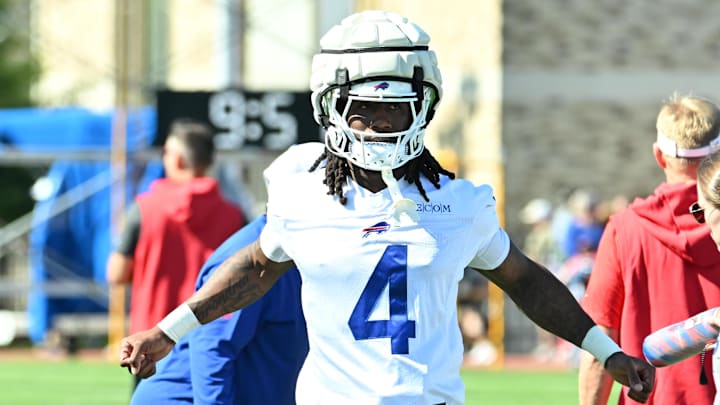 Jul 23, 2025; Rochester, NY, USA; Buffalo Bills running back James Cook (4) warms up during training camp at St. John Fisher University. Mandatory Credit: Mark Konezny-Imagn Images