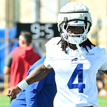 Jul 23, 2025; Rochester, NY, USA; Buffalo Bills running back James Cook (4) warms up during training camp at St. John Fisher University.