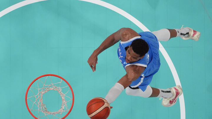 Jul 30, 2024; Villeneuve-d'Ascq, France; Greece small forward Giannis Antetokounmpo (34) shoots against Spain in a men's basketball group stage match during the Paris 2024 Olympic Summer Games at Stade Pierre-Mauroy. Mandatory Credit: John David Mercer-USA TODAY Sports