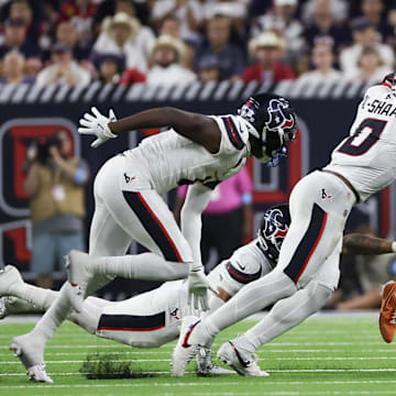 D'Andre Swift is dragged down as he tries to cut outside during Sunday's Bears loss. The running game has been a Bears problem almost as much as the pass blocking.