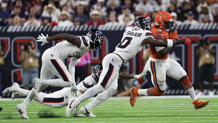 D'Andre Swift is dragged down as he tries to cut outside during Sunday's Bears loss. The running game has been a Bears problem almost as much as the pass blocking.