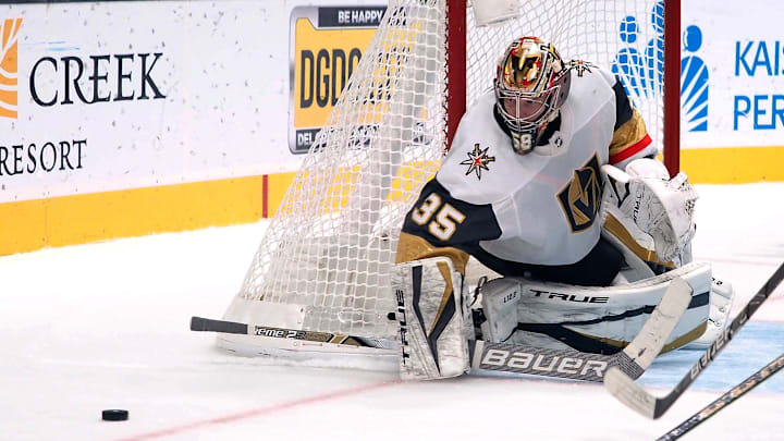 Mar 5, 2021; San Jose, California, USA; Vegas Golden Knights goalie Oscar Dansk (35) defends the goal against the San Jose Sharks during the first period at SAP Center at San Jose. Mandatory Credit: Kelley L Cox-Imagn Images