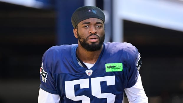 New England Patriots linebacker Josh Uche (55) heads to the practice fields at Gillette Stadium. 