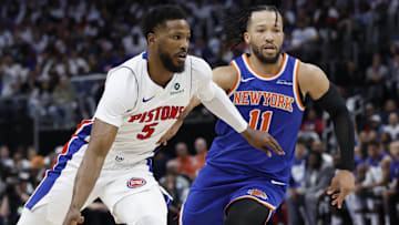 Former Detroit Pistons guard Malik Beasley (5) dribbles on New York Knicks guard Jalen Brunson (11) in the second half during game three of the first round of the 2024 NBA Playoffs at Little Caesars Arena.