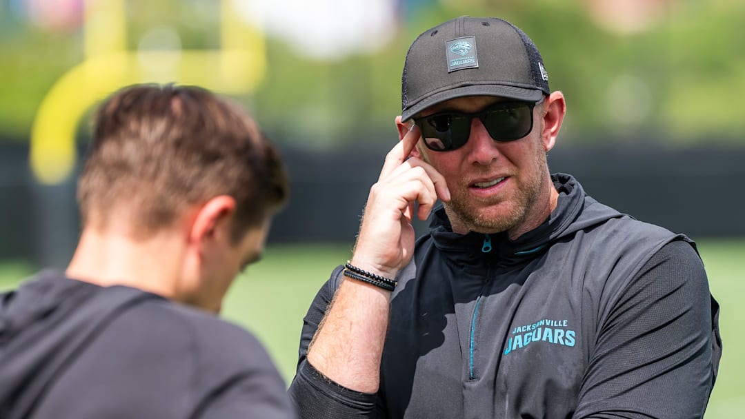Jacksonville Jaguars general manager James Gladstone, left, talks with Jacksonville Jaguars head coach Liam Coen, right, after the. Jacksonville Jaguars’ mandatory minicamp Tuesday June 10, 2025 at the Miller Electric Center in Jacksonville, Fla.