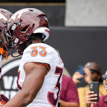 Aug 31, 2024; Nashville, Tennessee, USA;  Virginia Tech Hokies wide receiver Jaylin Lane (83) celebrates the touchdown of running back Bhayshul Tuten (33) gainst the Vanderbilt Commodores during the second half at FirstBank Stadium. Mandatory Credit: Steve Roberts-Imagn Images