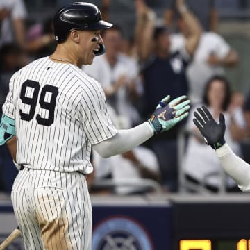 Jul 19, 2024; Bronx, New York, USA;  New York Yankees right fielder Juan Soto (22) is greeted by designated hitter Aaron Judge (99) after scoring in the fourth inning against the Tampa Bay Rays at Yankee Stadium. 