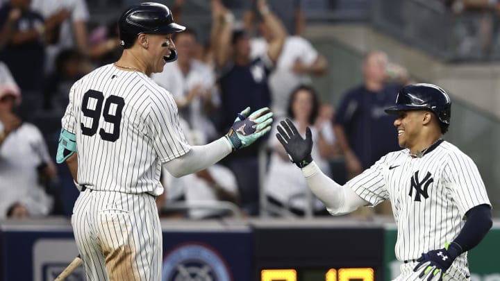 Jul 19, 2024; Bronx, New York, USA;  New York Yankees right fielder Juan Soto (22) is greeted by designated hitter Aaron Judge (99) after scoring in the fourth inning against the Tampa Bay Rays at Yankee Stadium. 