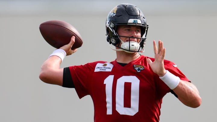 Jul 25, 2024; Jacksonville, FL, USA; Jacksonville Jaguars quarterback Mac Jones (10) participates in training camp at Miller Electric Center