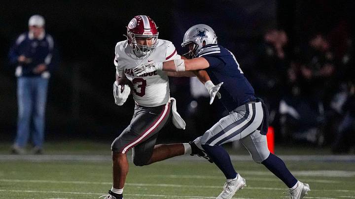 Farragut's Harrison Smith (1) tackles Oak Ridge's Malik Howard (3) during a TSSAA high school football game between Farragut and Oak Ridge High School on Oct. 23, 2025.