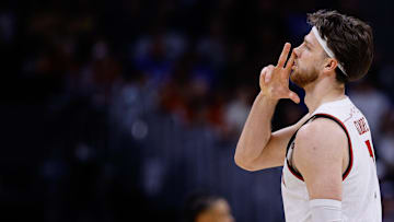 Mar 20, 2025; Denver, CO, USA; Wisconsin Badgers forward Carter Gilmore (7) celebrates after a basket against the Montana Grizzlies during the second half in the first round of the NCAA Tournament at Ball Arena. Mandatory Credit: Isaiah J. Downing-Imagn Images