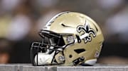 Aug 22, 2015; New Orleans, LA, USA; A New Orleans Saints helmet on the bench in the second half of their game against the New England Patriots at Mercedes-Benz Superdome. The Patriots won, 26-24. Mandatory Credit: Chuck Cook-Imagn Images