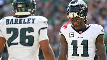 Philadelphia Eagles wide receiver AJ. Brown (11) and running back Saquon Barkley (26) during the fourth quarter against the Los Angeles Rams at Lincoln Financial Field.