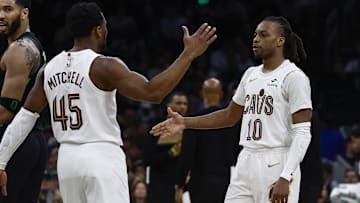 Feb 28, 2025; Boston, Massachusetts, USA; Cleveland Cavaliers guard Donovan Mitchell (45) and guard Darius Garland (10) congratulate each other as Boston Celtics forward Jayson Tatum (0) looks back during the second half at TD Garden. Mandatory Credit: Winslow Townson-Imagn Images