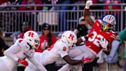Ohio State Buckeyes running back Isaiah West (32) is pushed out of bounds by Rutgers Scarlet Knights defensive back Jett Elad (9) in the second half of the NCAA football game at Ohio Stadium on Saturday, Nov. 22, 2025 in Columbus, Ohio.