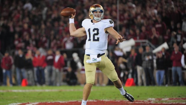 Andrew Hendrix throws a pass for Notre Dame against Stanford.