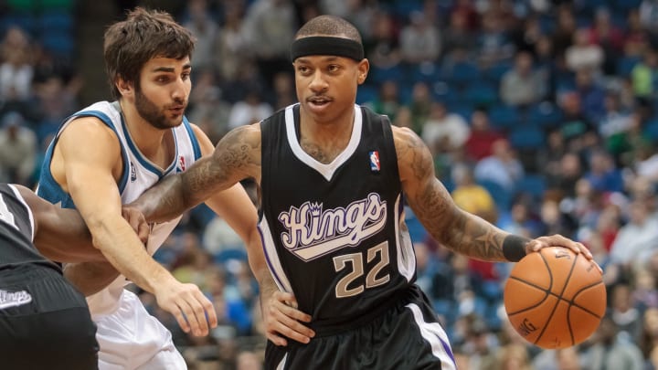 Mar 16, 2014; Minneapolis, MN, USA; Sacramento Kings guard Isaiah Thomas (22) dribbles in the first quarter against the Minnesota Timberwolves guard Ricky Rubio (9) at Target Center. Mandatory Credit: Brad Rempel-USA TODAY Sports