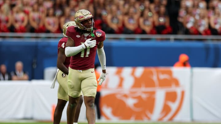 Dec 30, 2023; Miami Gardens, FL, USA; Florida State Seminoles defensive lineman Patrick Payton (11) reacts against the Georgia Bulldogs during the first half in the 2023 Orange Bowl at Hard Rock Stadium. Mandatory Credit: Nathan Ray Seebeck-USA TODAY Sports