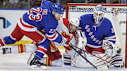 Mar 18, 2025; New York, New York, USA;  New York Rangers goaltender Igor Shesterkin (31) defends the net as  defenseman Adam Fox (23) and Calgary Flames left wing Blake Coleman (20) battle for control of the puck in the second period at Madison Square Garden. Mandatory Credit: Wendell Cruz-Imagn Images