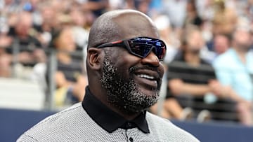 Sep 15, 2024; Arlington, Texas, USA; Former NBA player Shaquille O'Neal stands on the sidelines before a game between the New Orleans Saints and Dallas Cowboys at AT&T Stadium. Mandatory Credit: Tim Heitman-Imagn Images
