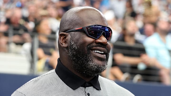 Sep 15, 2024; Arlington, Texas, USA; Former NBA player Shaquille O'Neal stands on the sidelines before a game between the New Orleans Saints and Dallas Cowboys at AT&T Stadium. Mandatory Credit: Tim Heitman-Imagn Images