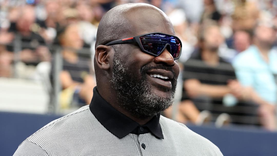 Sep 15, 2024; Arlington, Texas, USA; Former NBA player Shaquille O'Neal stands on the sidelines before a game between the New Orleans Saints and Dallas Cowboys at AT&T Stadium Sep 15, 2024; Arlington, Texas, USA; Former NBA player Shaquille O'Neal stands on the sidelines before a game between the New Orleans Saints and Dallas Cowboys at AT&T Stadium