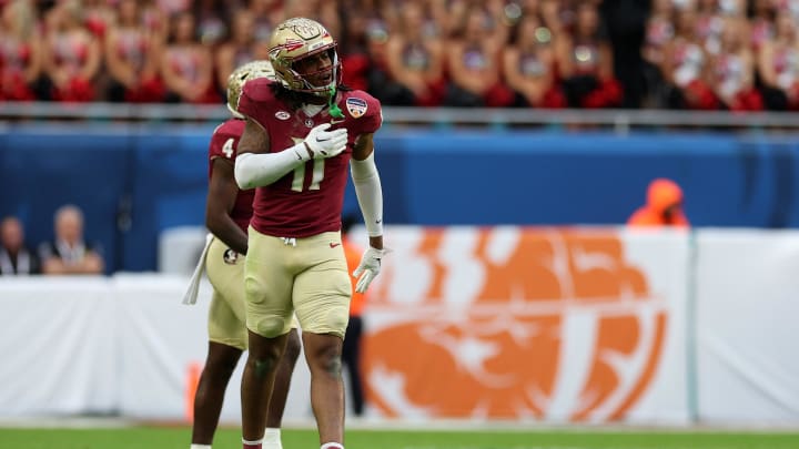 Dec 30, 2023; Miami Gardens, FL, USA; Florida State Seminoles defensive lineman Patrick Payton (11) reacts against the Georgia Bulldogs during the first half in the 2023 Orange Bowl at Hard Rock Stadium. Mandatory Credit: Nathan Ray Seebeck-USA TODAY Sports
