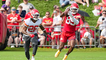 Jul 22, 2025; St. Joseph, MO, USA; Kansas City Chiefs wide receiver Jason Brownlee (89) catches a pass as safety Deon Bush (26) defends during training camp at Missouri Western State University. Mandatory Credit: Denny Medley-Imagn Images