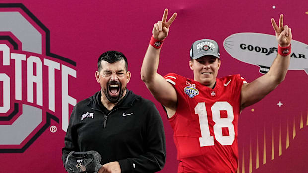 Ohio State Buckeyes head coach Ryan Day celebrates with quarterback Will Howard (18) following the 28-14 win over the Texas L