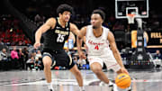 Mar 13, 2025; Kansas City, MO, USA; Houston Cougars guard L.J. Cryer (4) drives to the basket around Colorado Buffaloes guard Felix Kossaras (15) during the first half at T-Mobile Center. Mandatory Credit: William Purnell-Imagn Images
