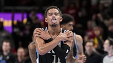 Atlanta Hawks guard Trae Young (11) reacts after making a three point basket against the Indiana Pacers